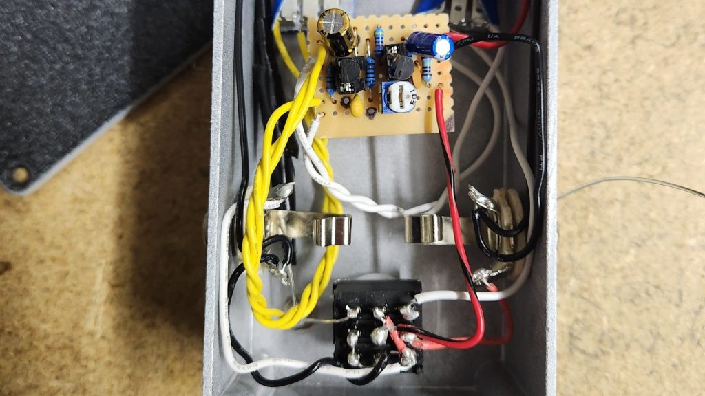 Inside of a DIY Vox Tone Bender guitar pedal built on stripboard.