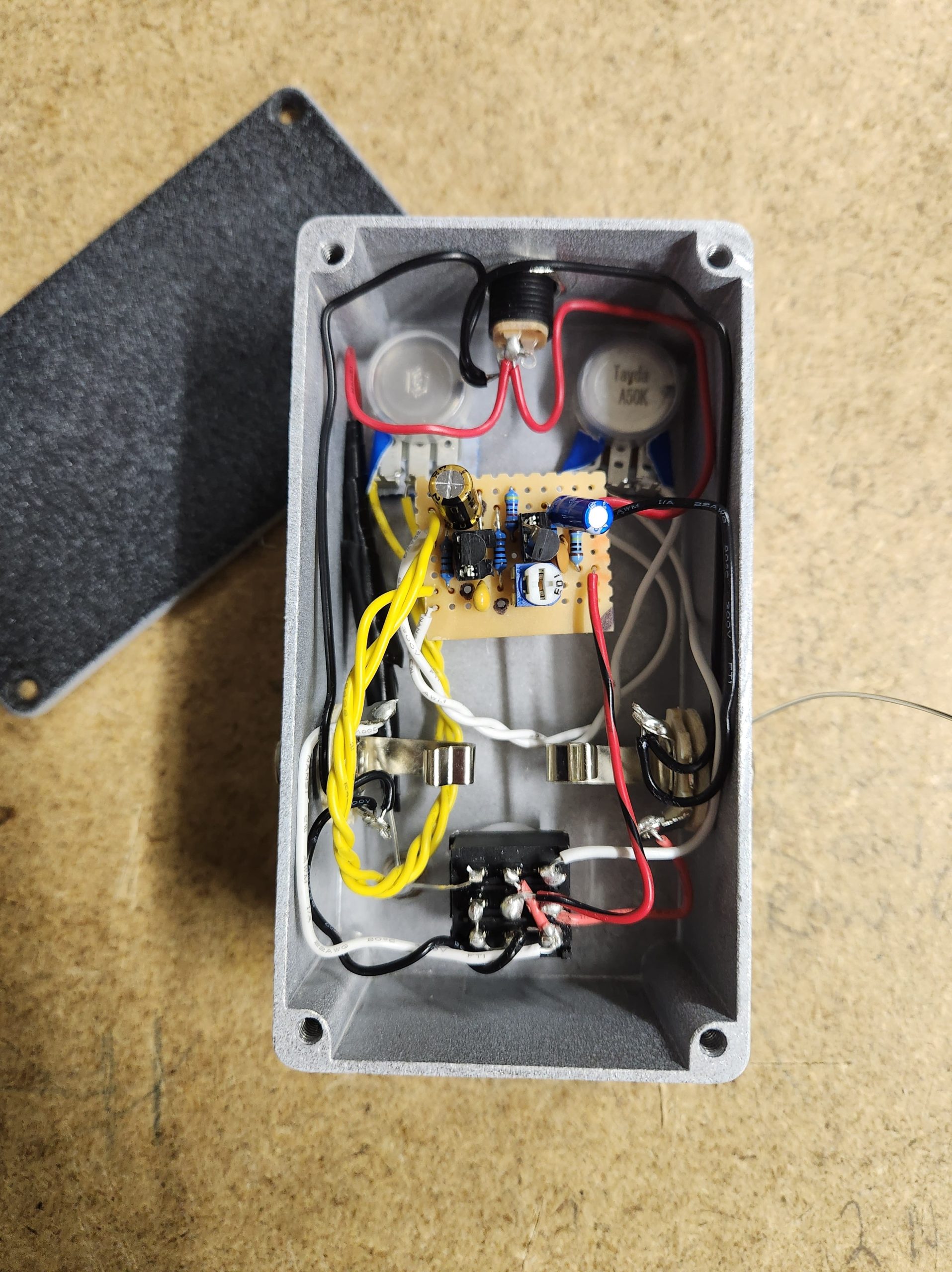 Inside of a DIY Vox Tone Bender guitar pedal built on stripboard.